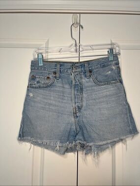 Levi’s High-Rise Ribcage Light Blue Denim Jean Shorts with Frayed Hem
